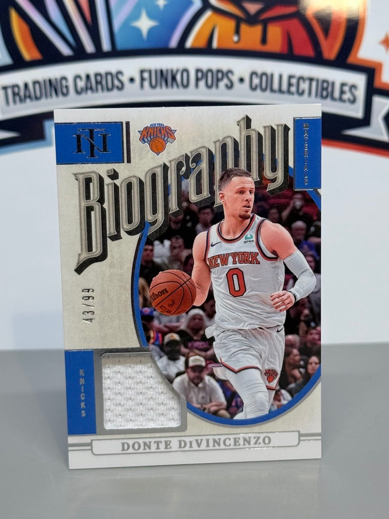 2024-25 Panini National Treasures Donte DiVincenzo Biography Materials Jersey Patch /99 #BM-DDV - New York Knicks
